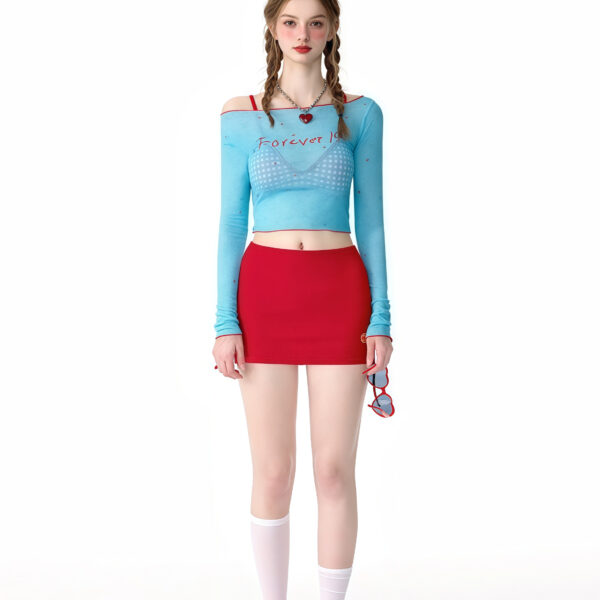Four-piece beachwear set featuring two bikinis, a stylish top, and matching shorts for a trendy, playful beach look.