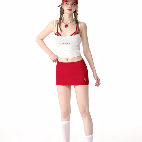 Four-piece bikini set with embroidered suspenders, including two bikinis, a top, and a red skirt or shorts for a stylish beach look.