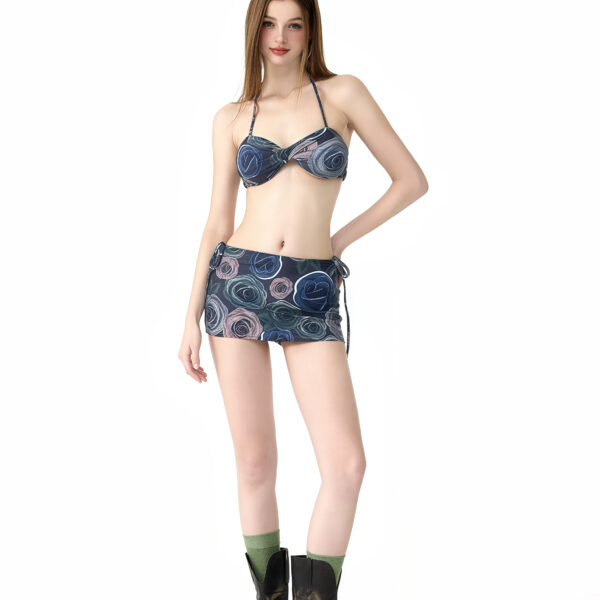 Floral bikini set with adjustable straps, paired with a matching skirt for a chic and comfortable beach outfit.